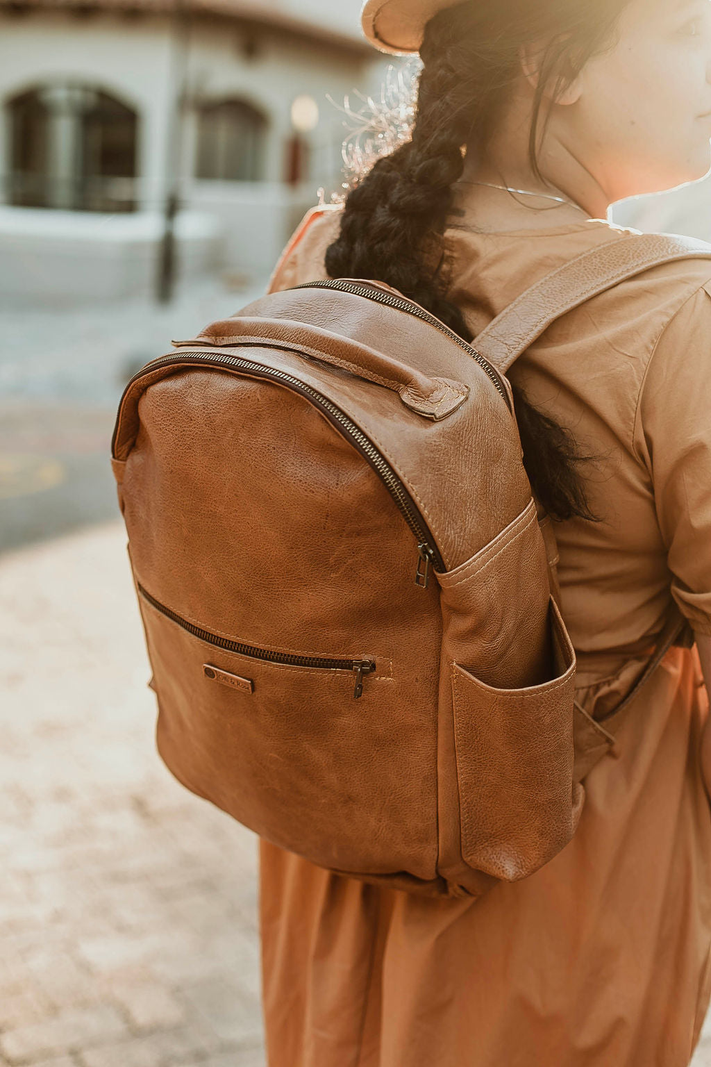 Orange best sale leather backpack